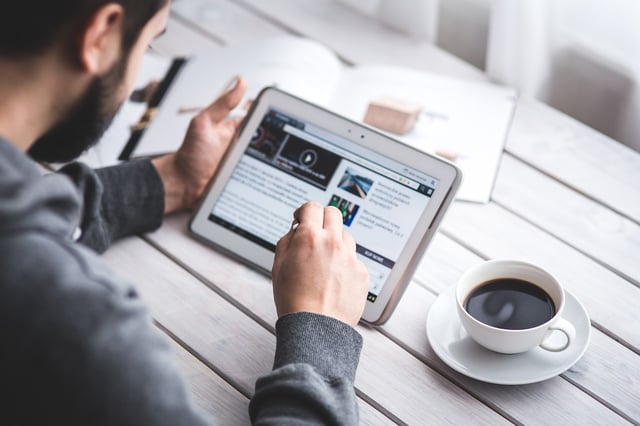 man-reading-tablet-generic-photo.jpg